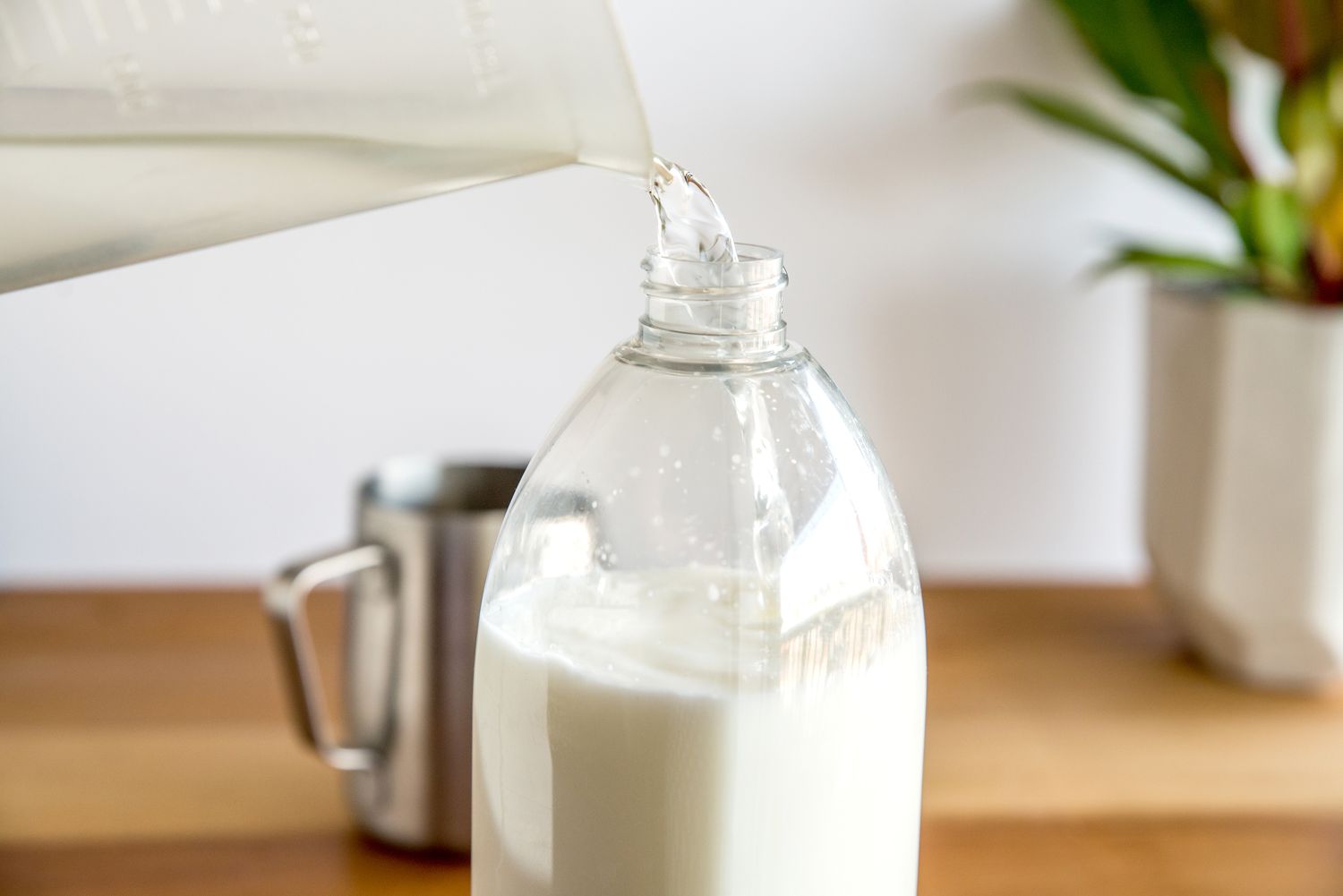 filling a spray bottle with ingredients