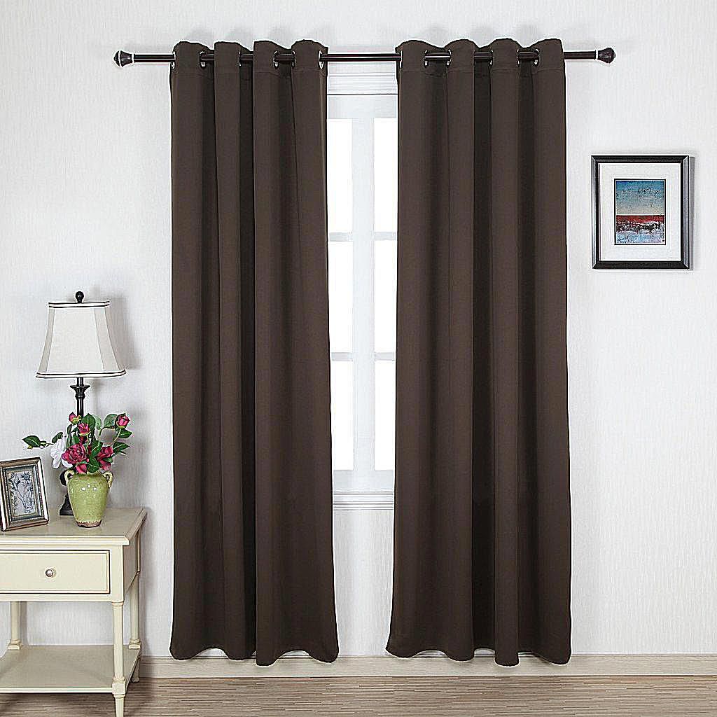 deep brown ring top panel curtains against white window panes and walls 