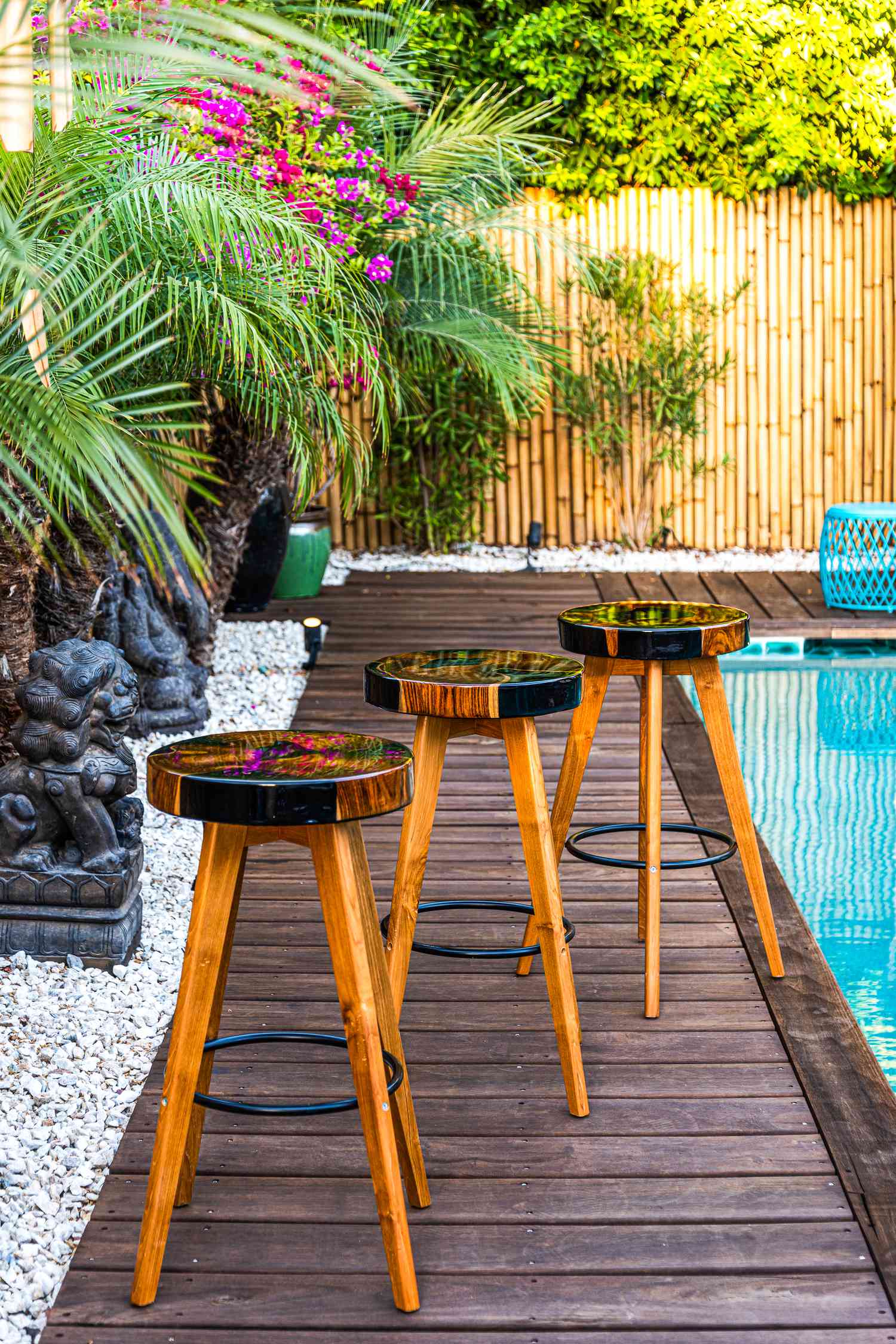 3 hand-designed stools at a pool side