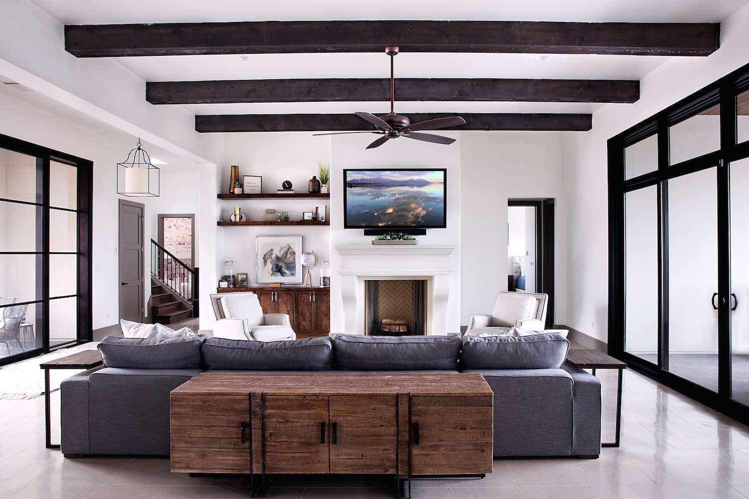 great room with exposed beams and rustic design