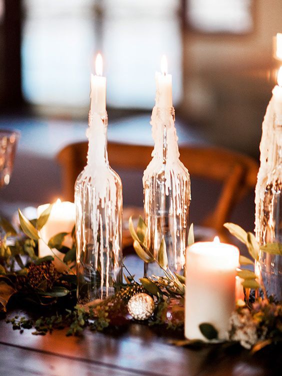 melted candle centerpiece with pinecones