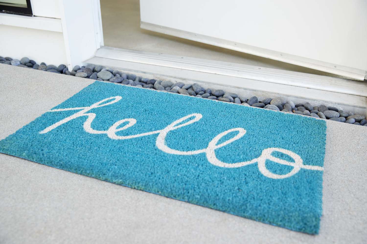blue - teal Doormat Outside Open Front Door Of House