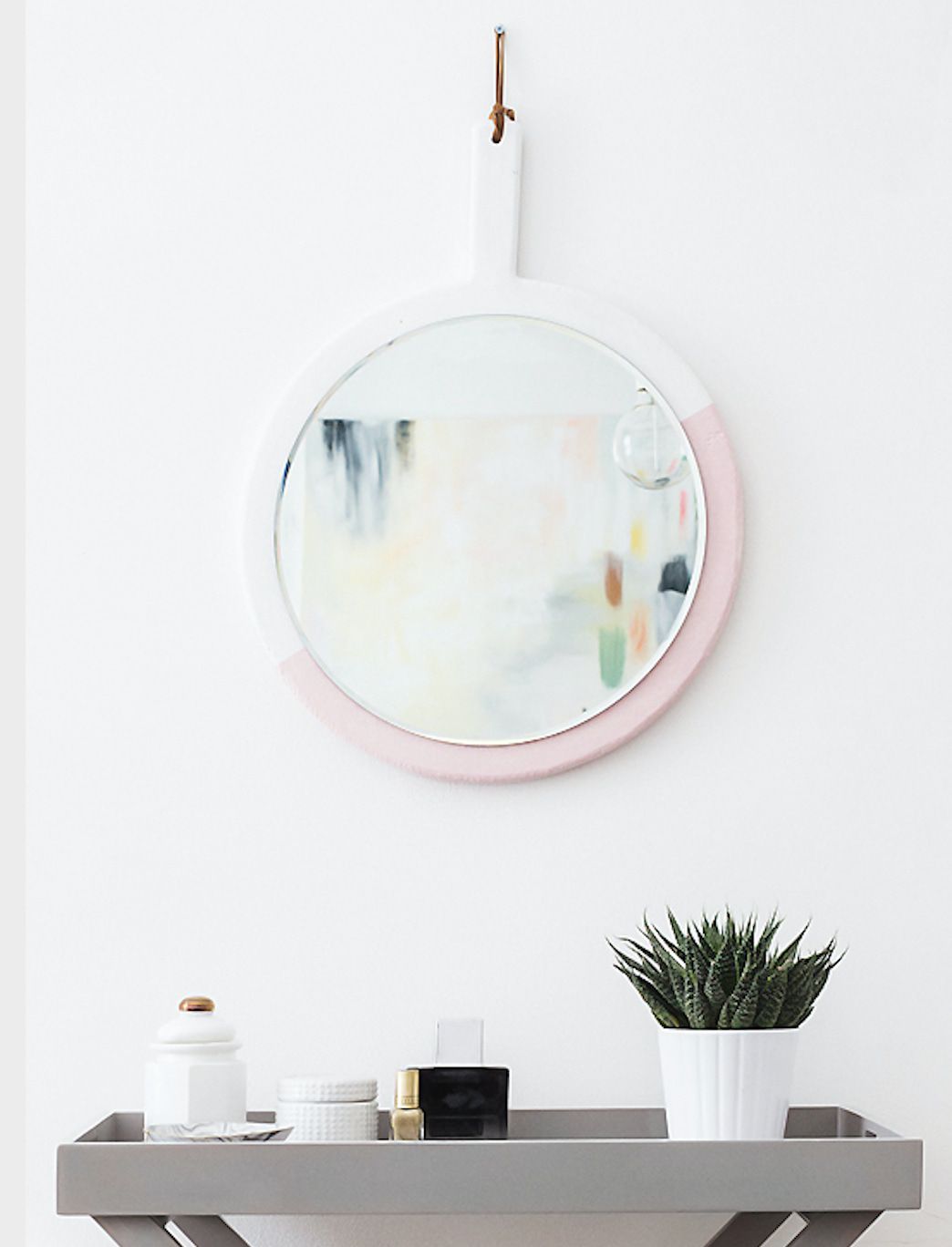 a round color block DIY mirror frame in pink and white