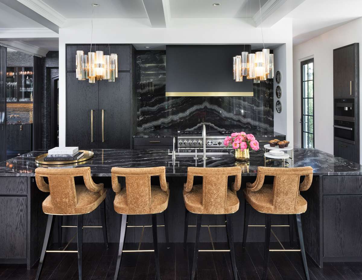 Glam black kitchen with black countertop