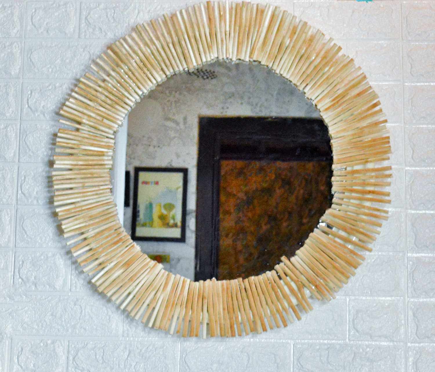 a DIY round mirror made using sticks