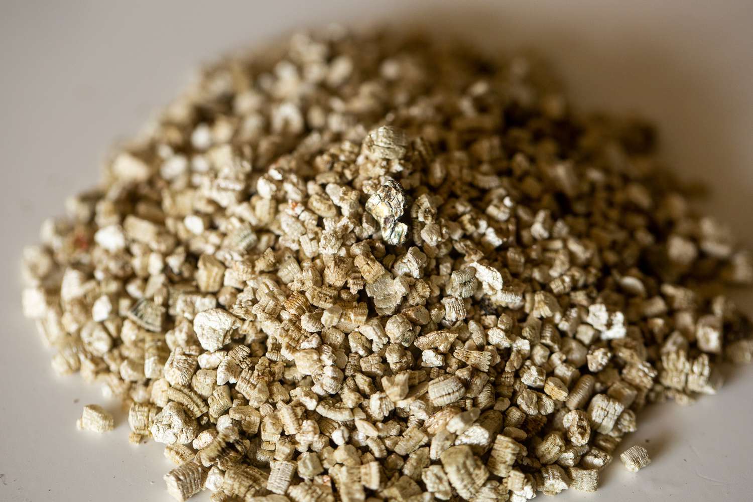 Pile of vermiculite flecks for soilless potting mix closeup