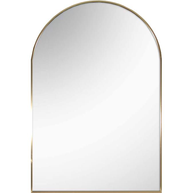 A gold arched mirror