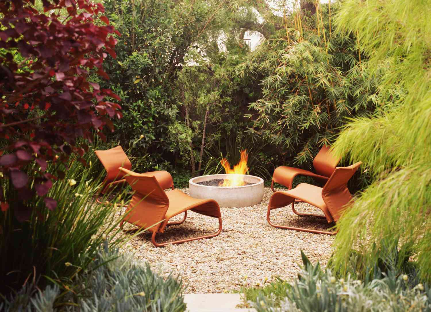 modern chairs by fire pit