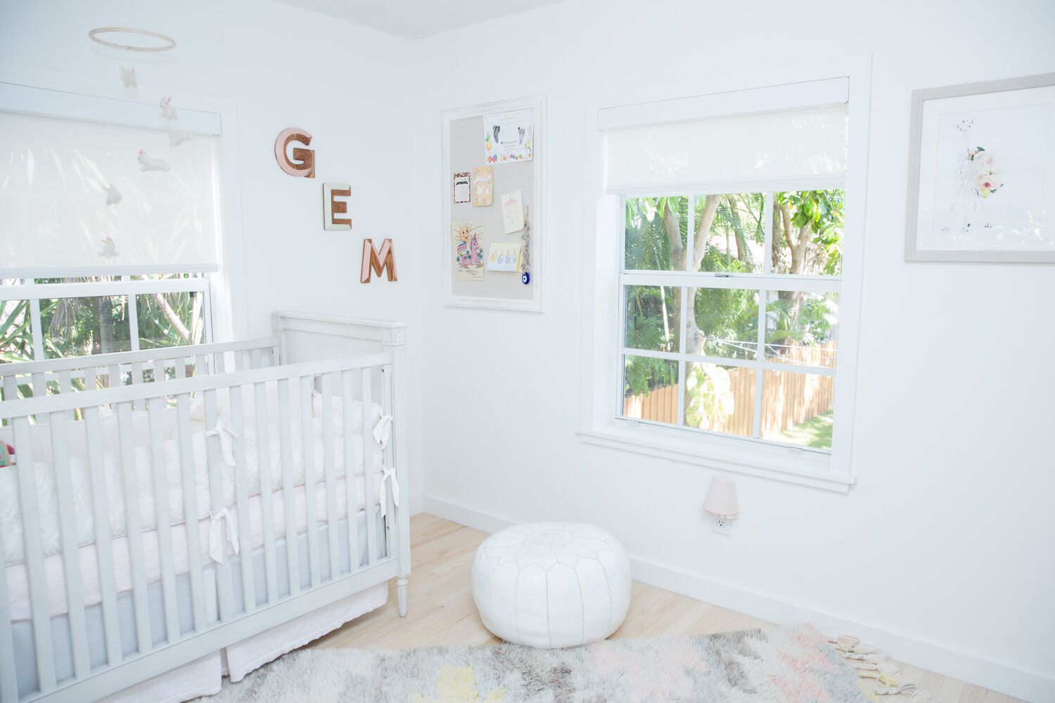 all white nursery with letters 