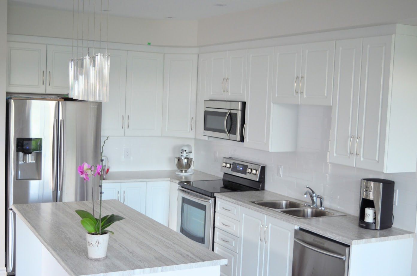 Flawless white kitchen with laminate countertops
