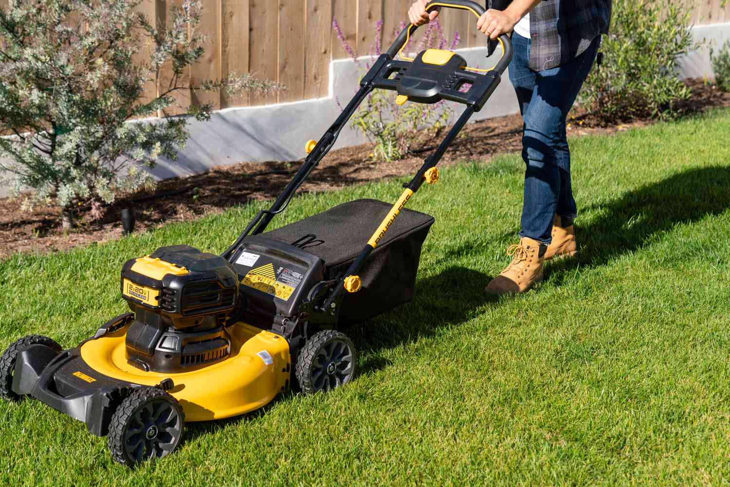 Person using a lawn mower