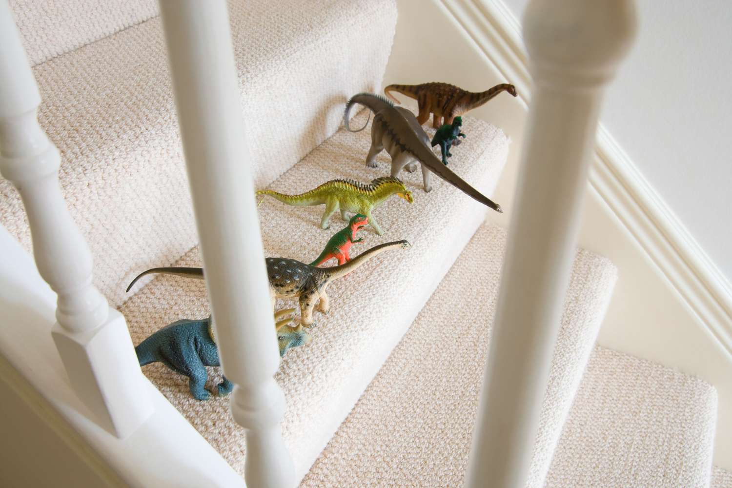 Toy dinosaurs on staircase