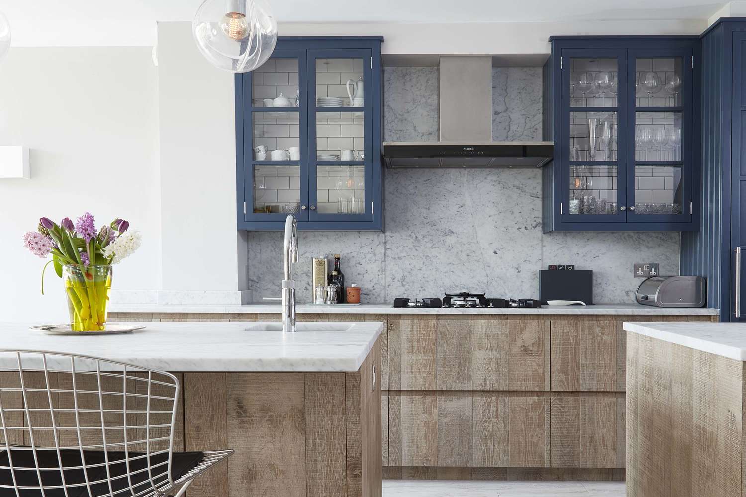 Blue upper kitchen cabinets with rustic wood lower cabinets