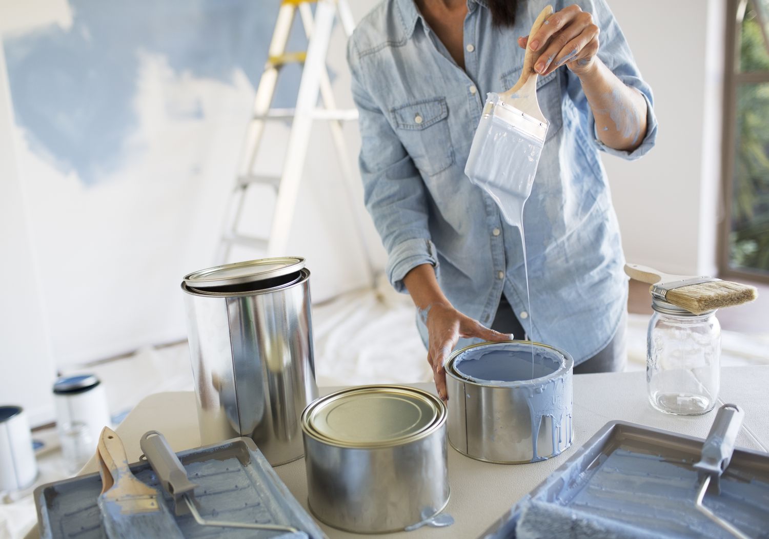 Woman holding paintbrush