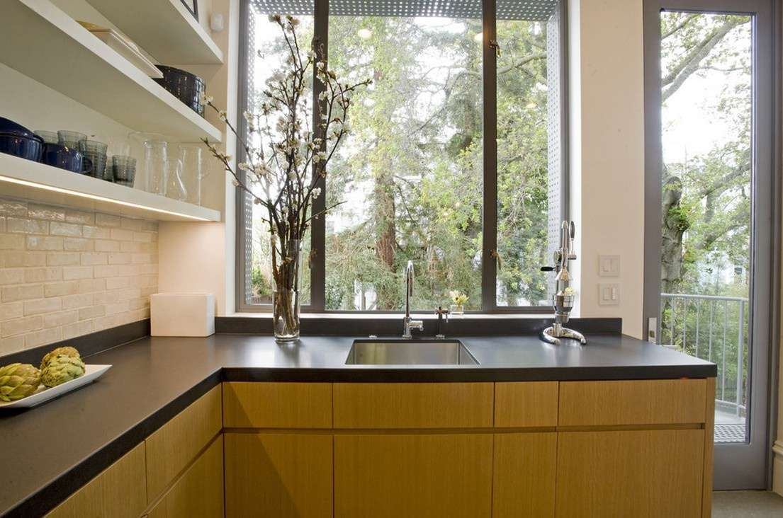 black laminate countertops with wood cabinets