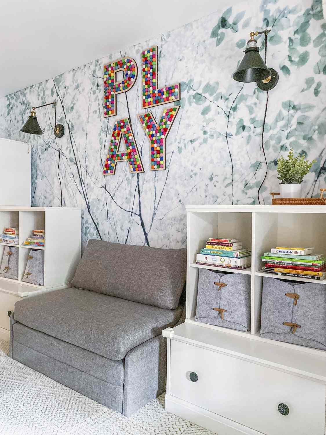 tree branches and leaves speckled throughout bring the outdoors inside in this playroom