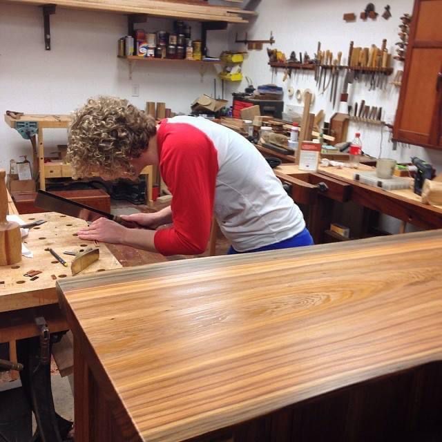 Katie making jewelry at her workbench