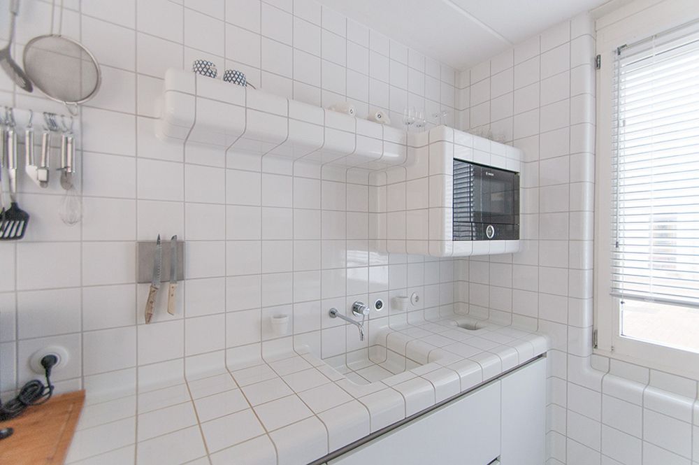 white square tile kitchen counter sink and backsplash