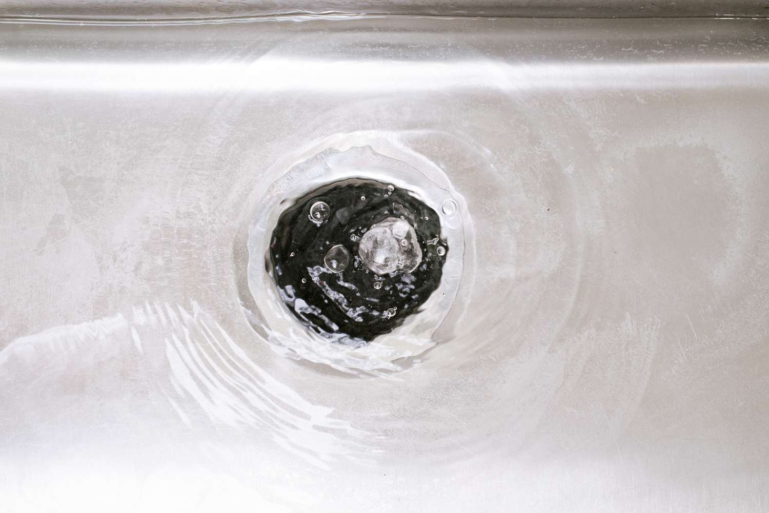 Water running through flush sink garbage disposal