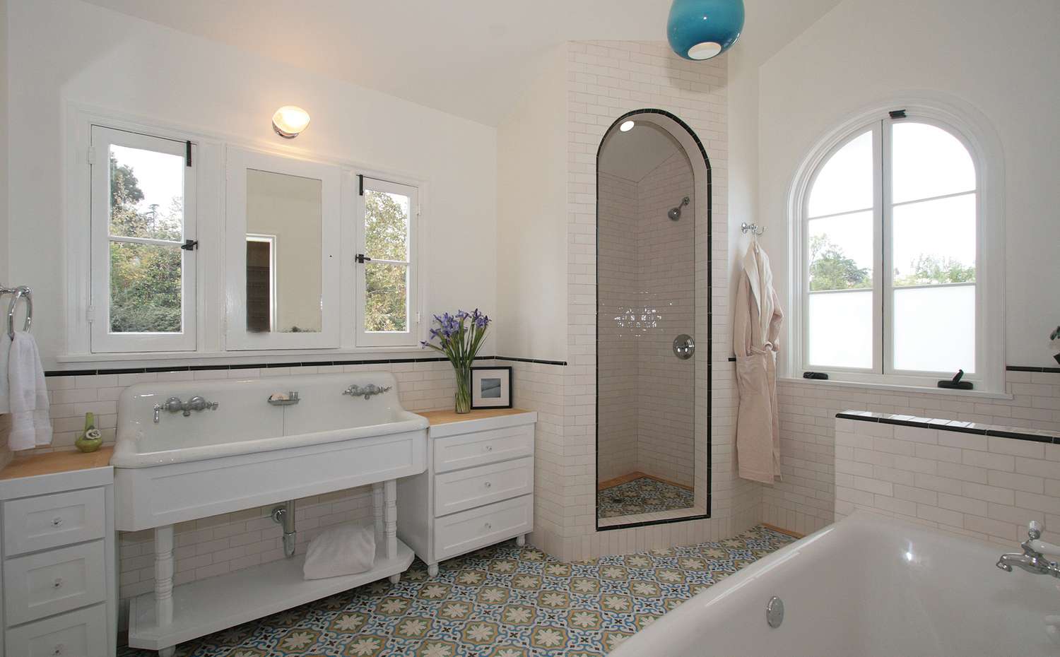 colorful floor tile in white bathroom