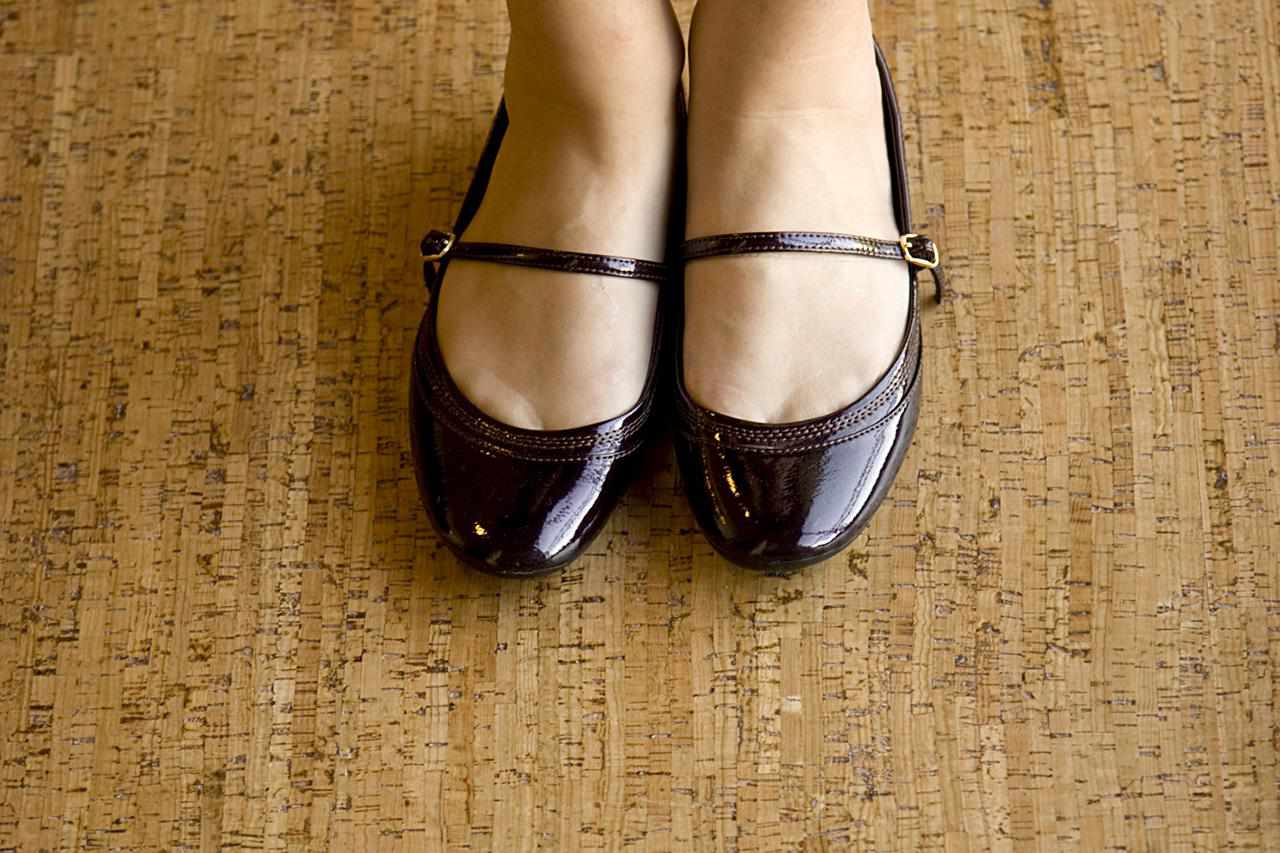 woman's feet on a cork floor