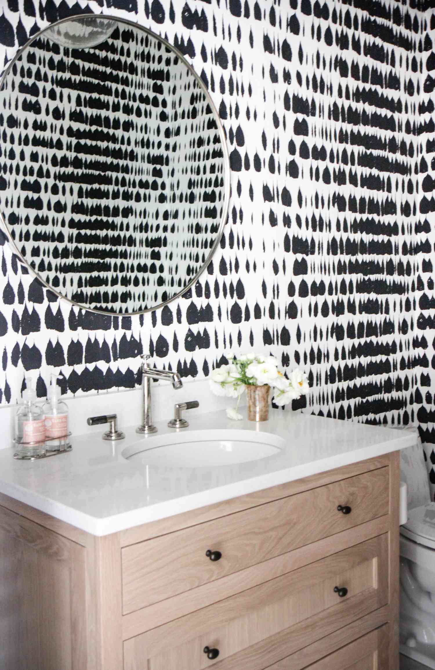 patterned wallpaper in neutral bathroom