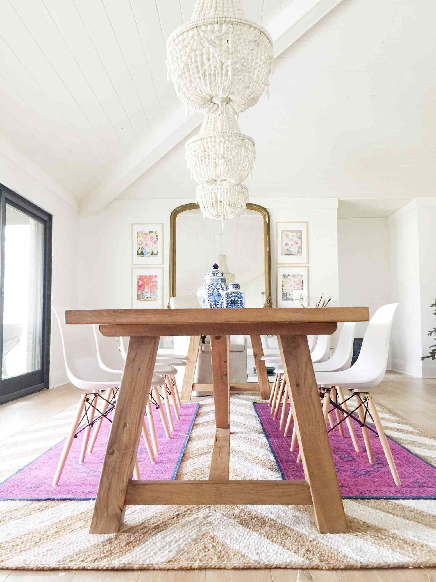 colorful rugs layered over jute in dining room