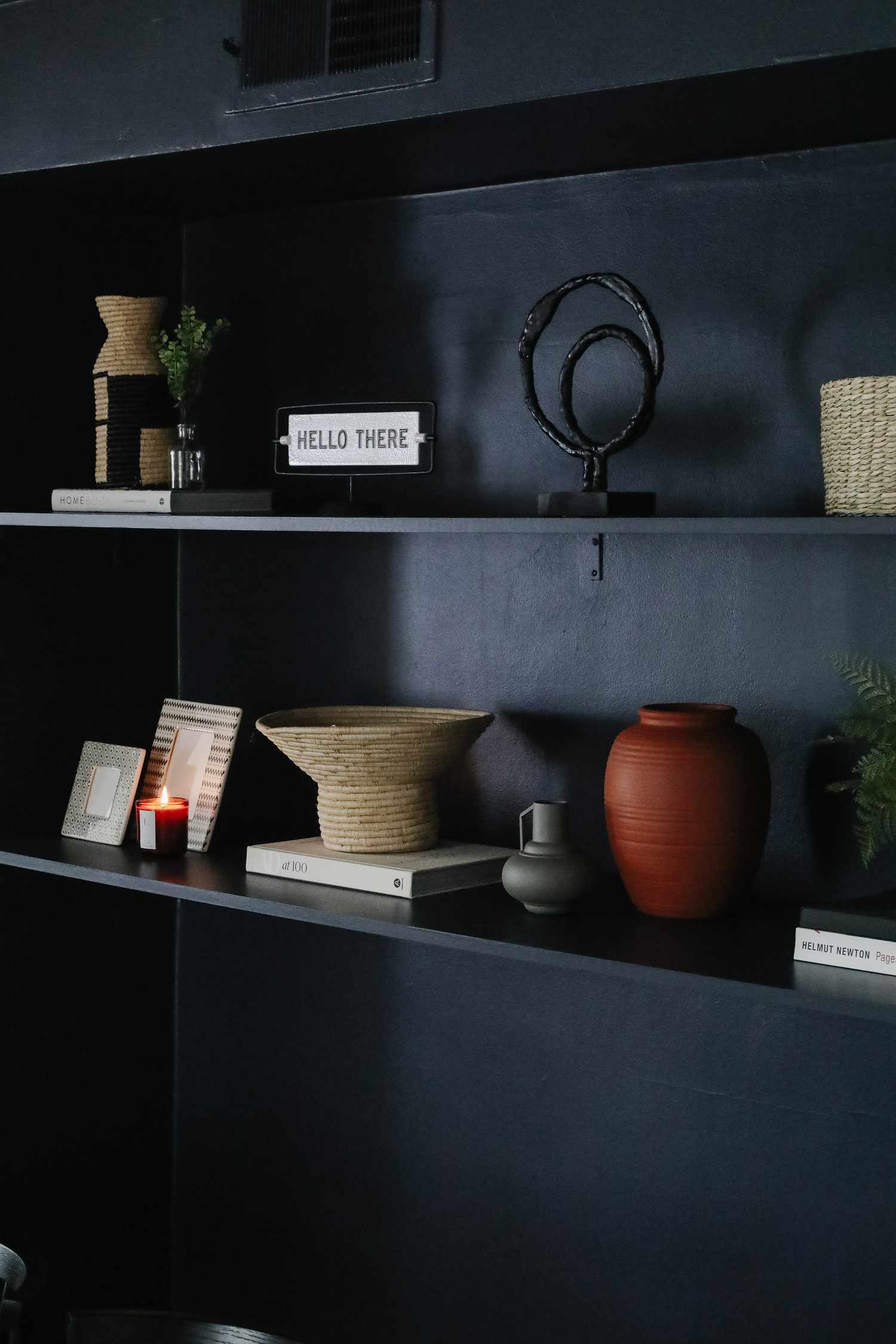 black shelves are part of the decor of drew scott's apartment