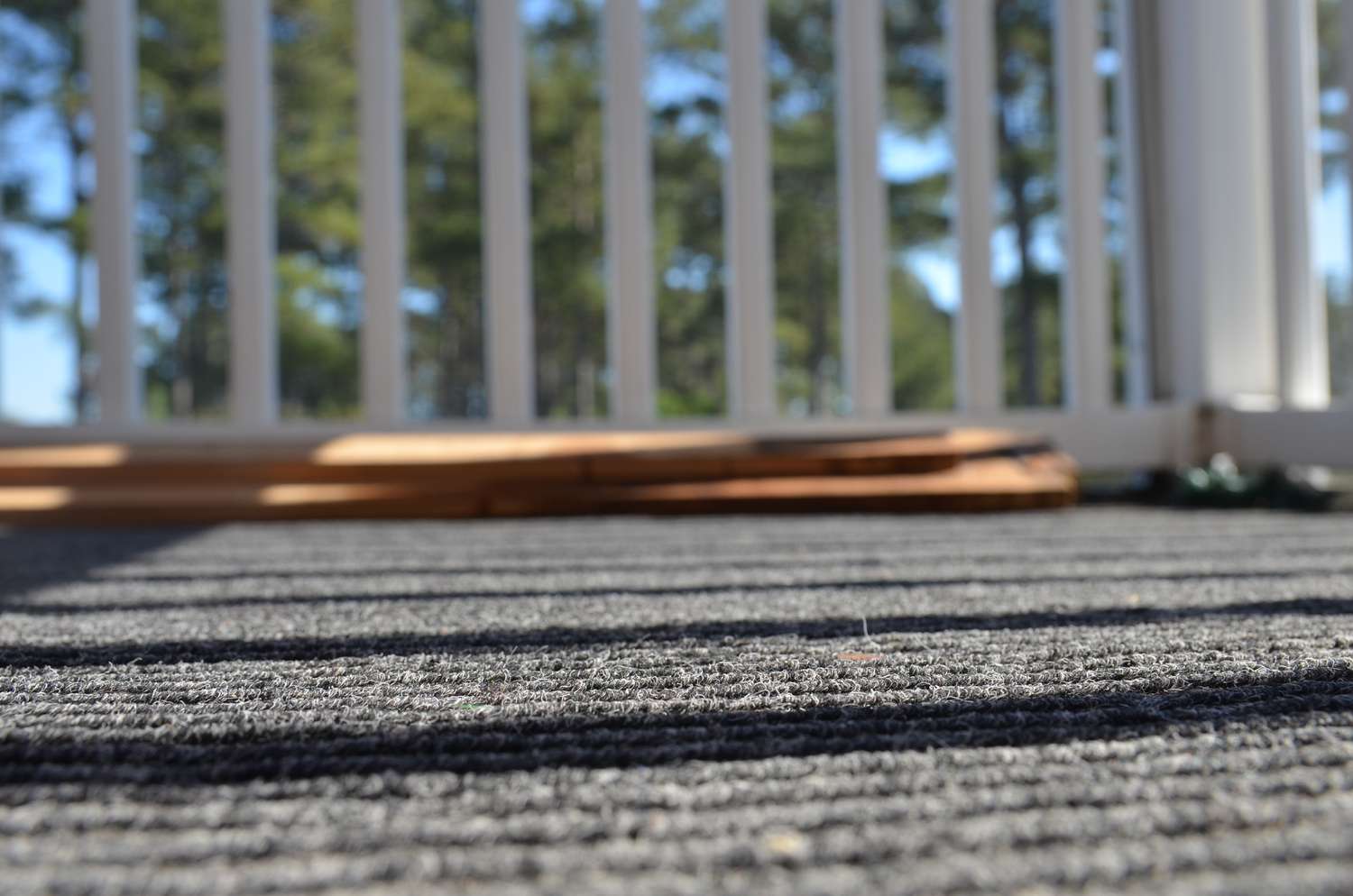 Surface Level View Of Indoor Outdoor Carpet And Railing
