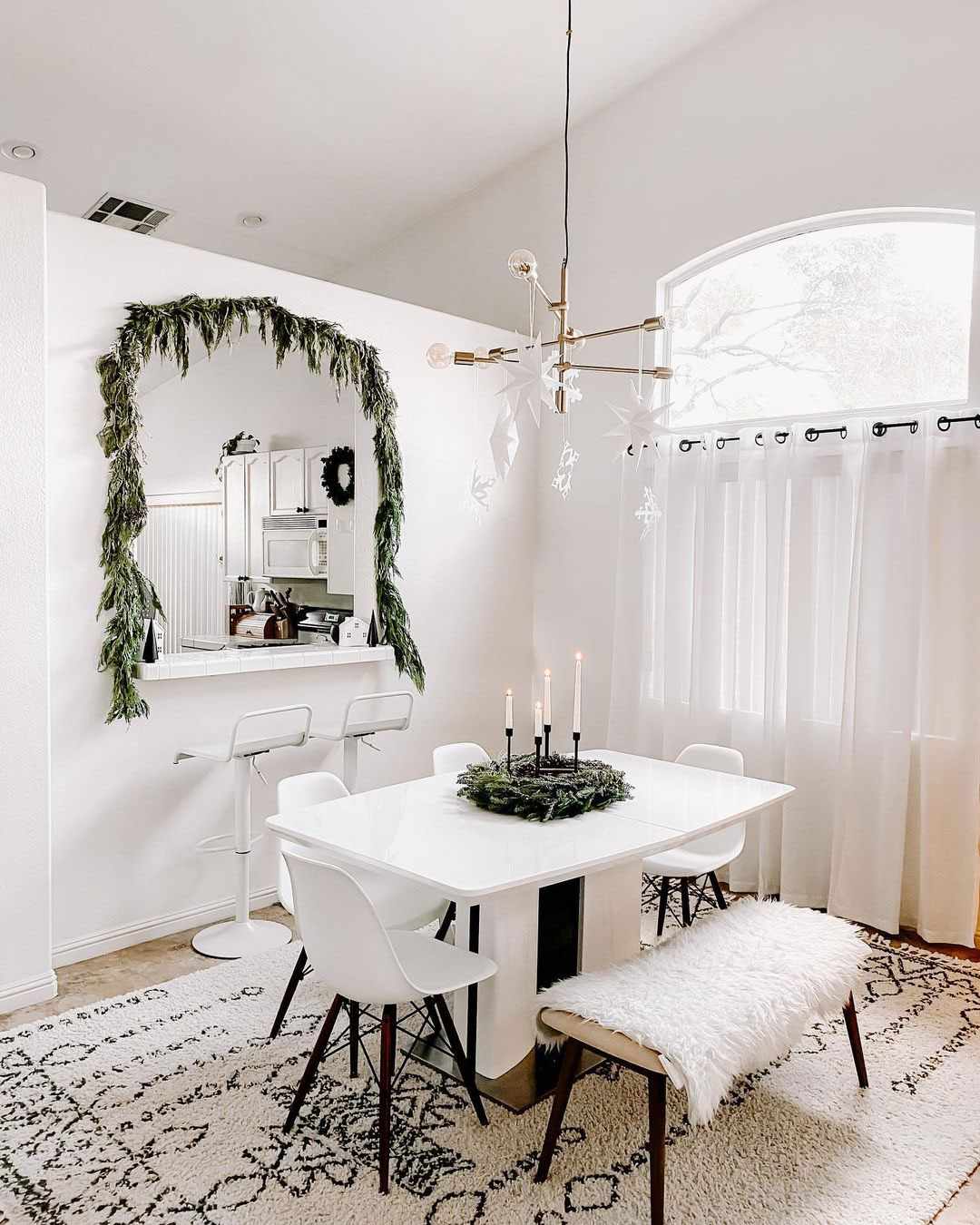 Floating paper stars and snowflakes with fishing wire in dining room