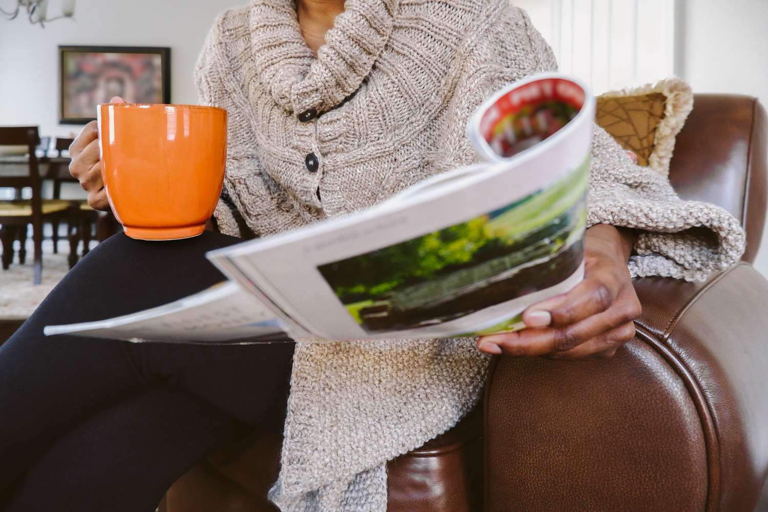 Woman Reads Magazine in Chair