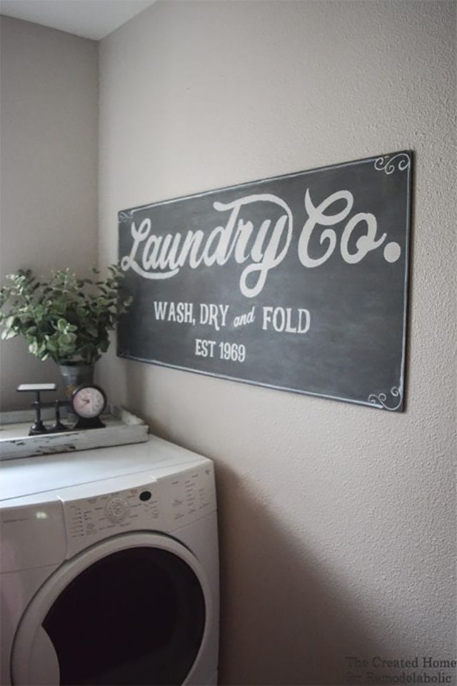 A black and white laundry sign