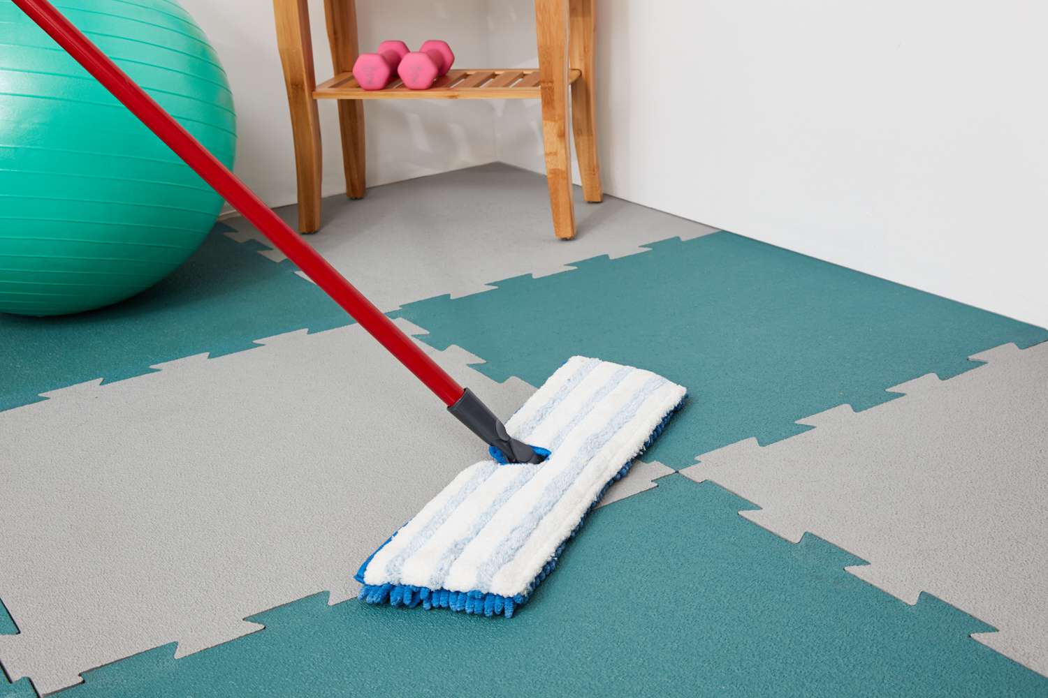 Mopping rubber floor tiles
