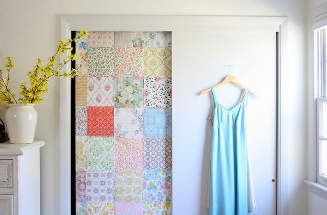 Wallpappered sliding closet door.