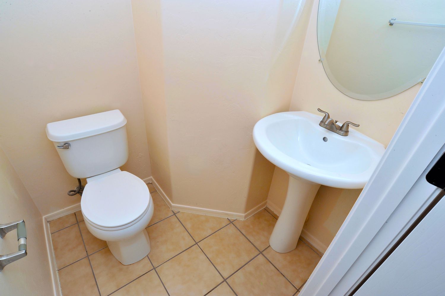 Pedestal sink in odd shaped bathroom