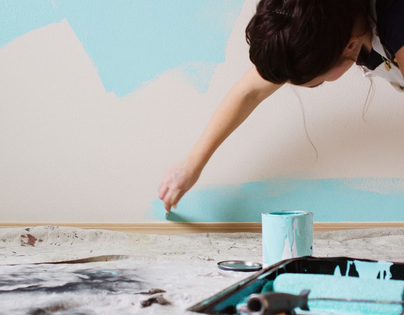 woman painting a wall