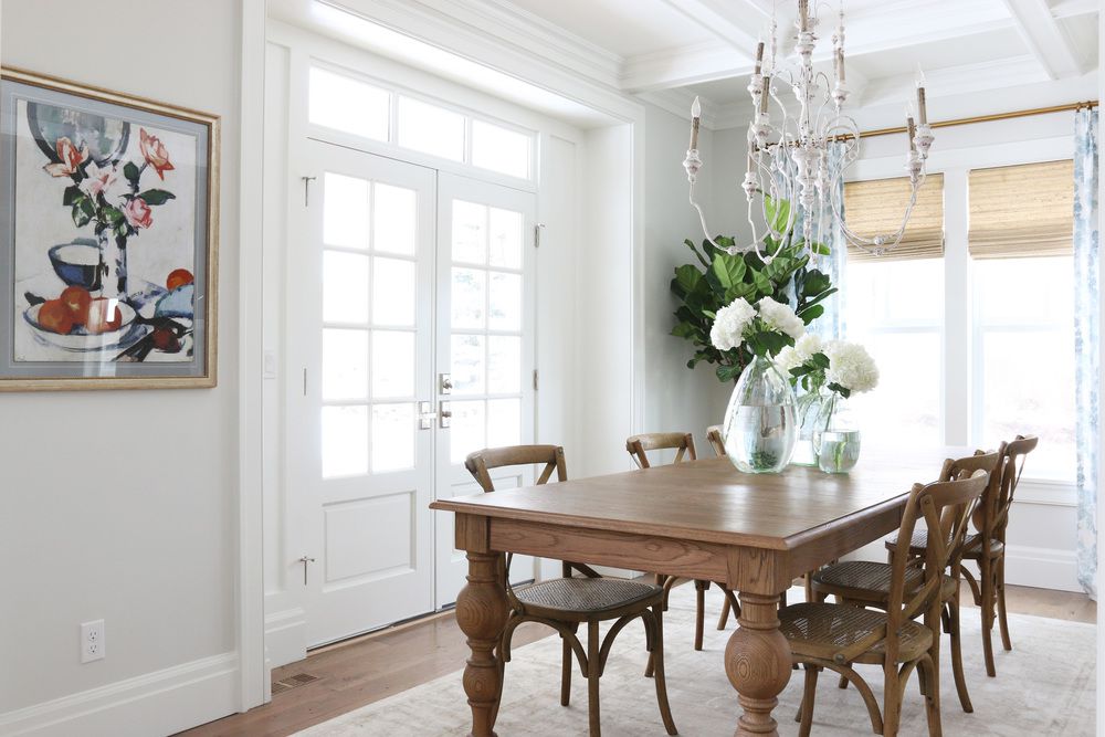 Gray walls in dining room with chandelier