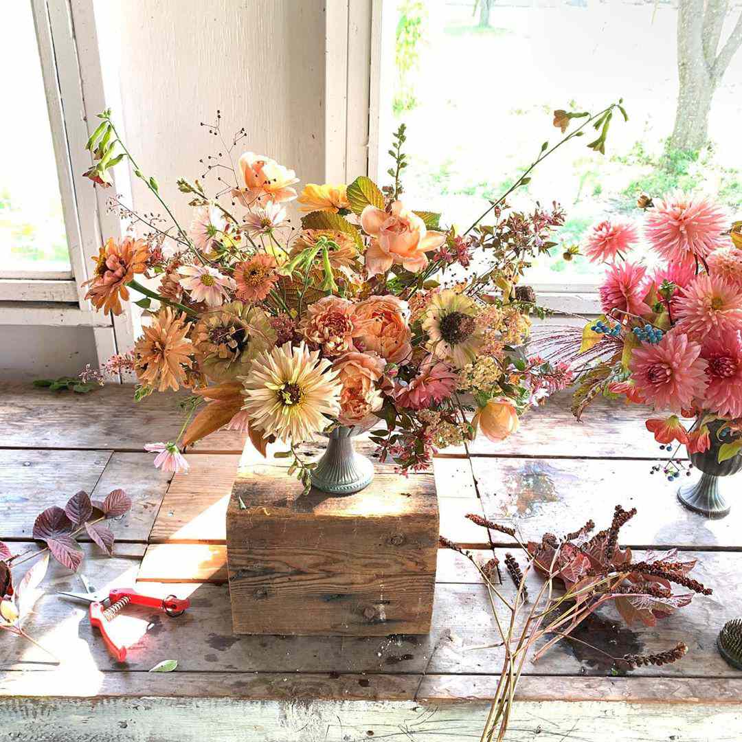 Floral bouquet sitting on wooden box