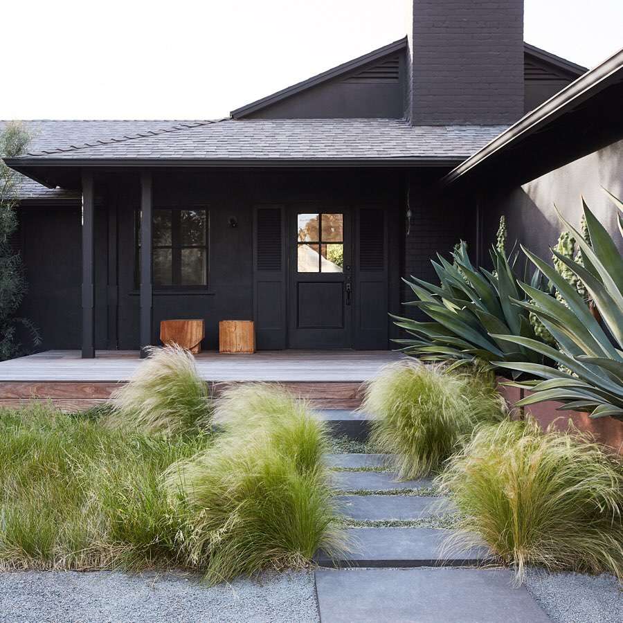 Black house with wide porch