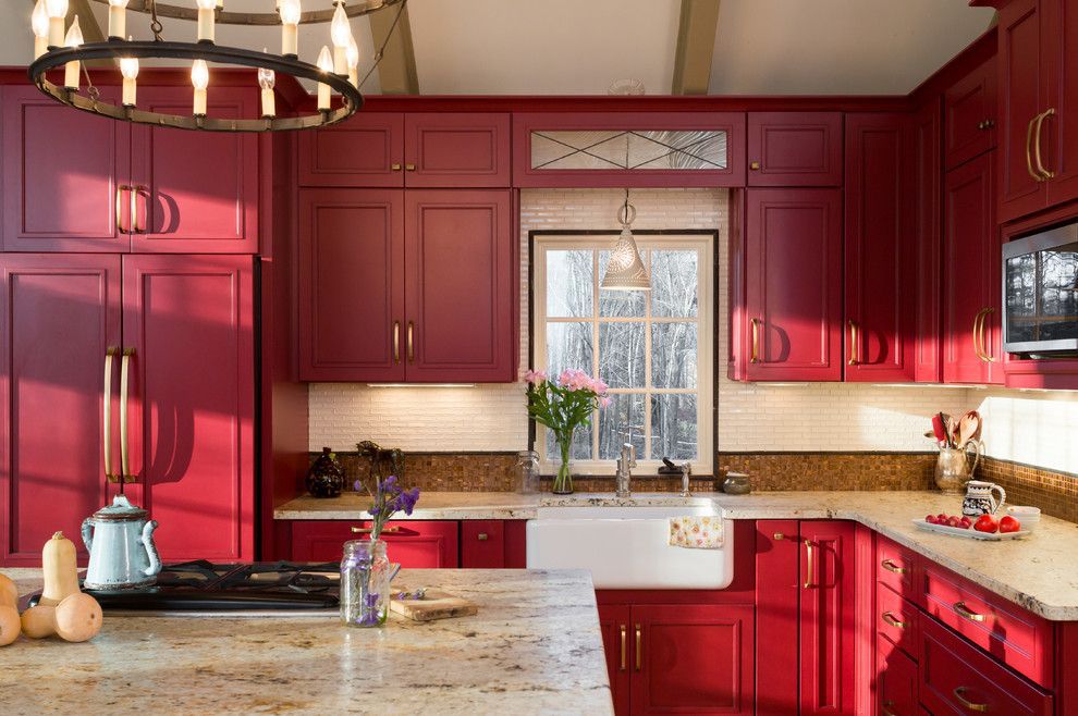 Red farmhouse kitchen with granite countertops