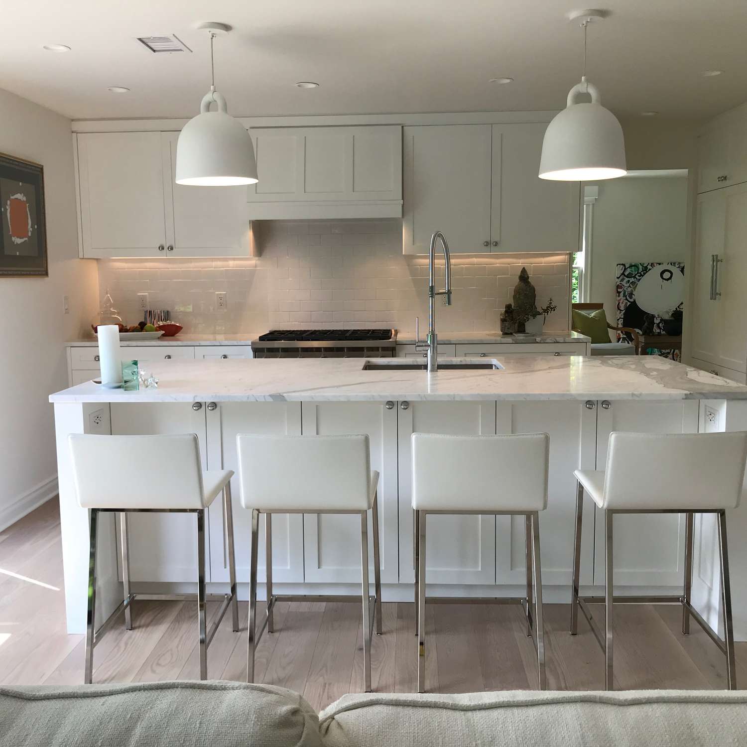 Crisp white modern open kitchen in apartment