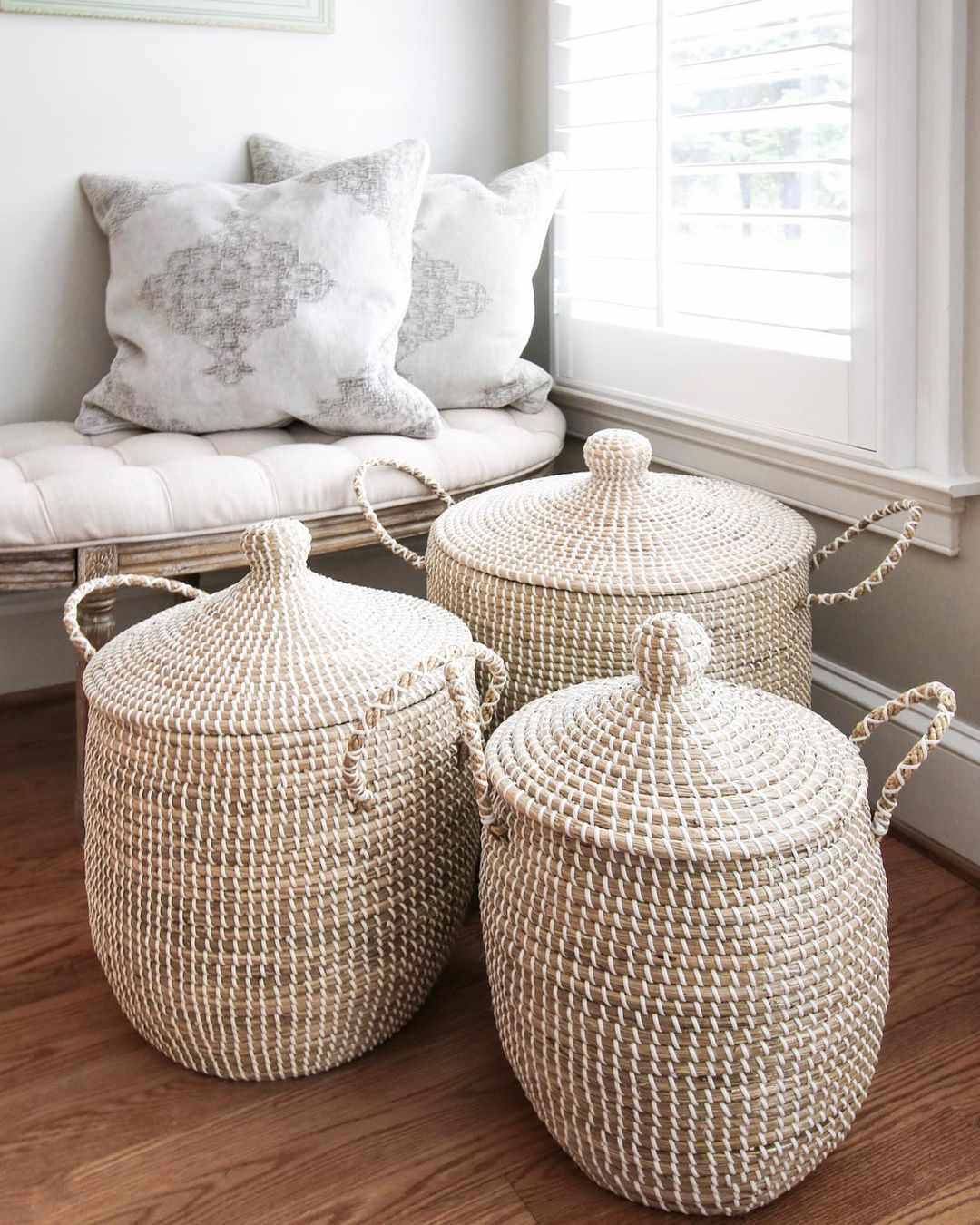 Three woven lidded baskets.