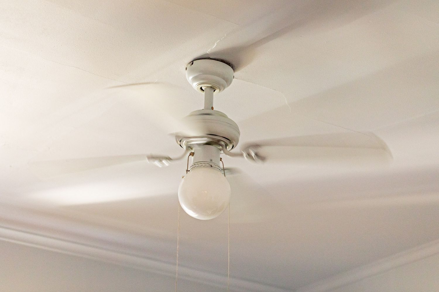 a ceiling fan that's turned on