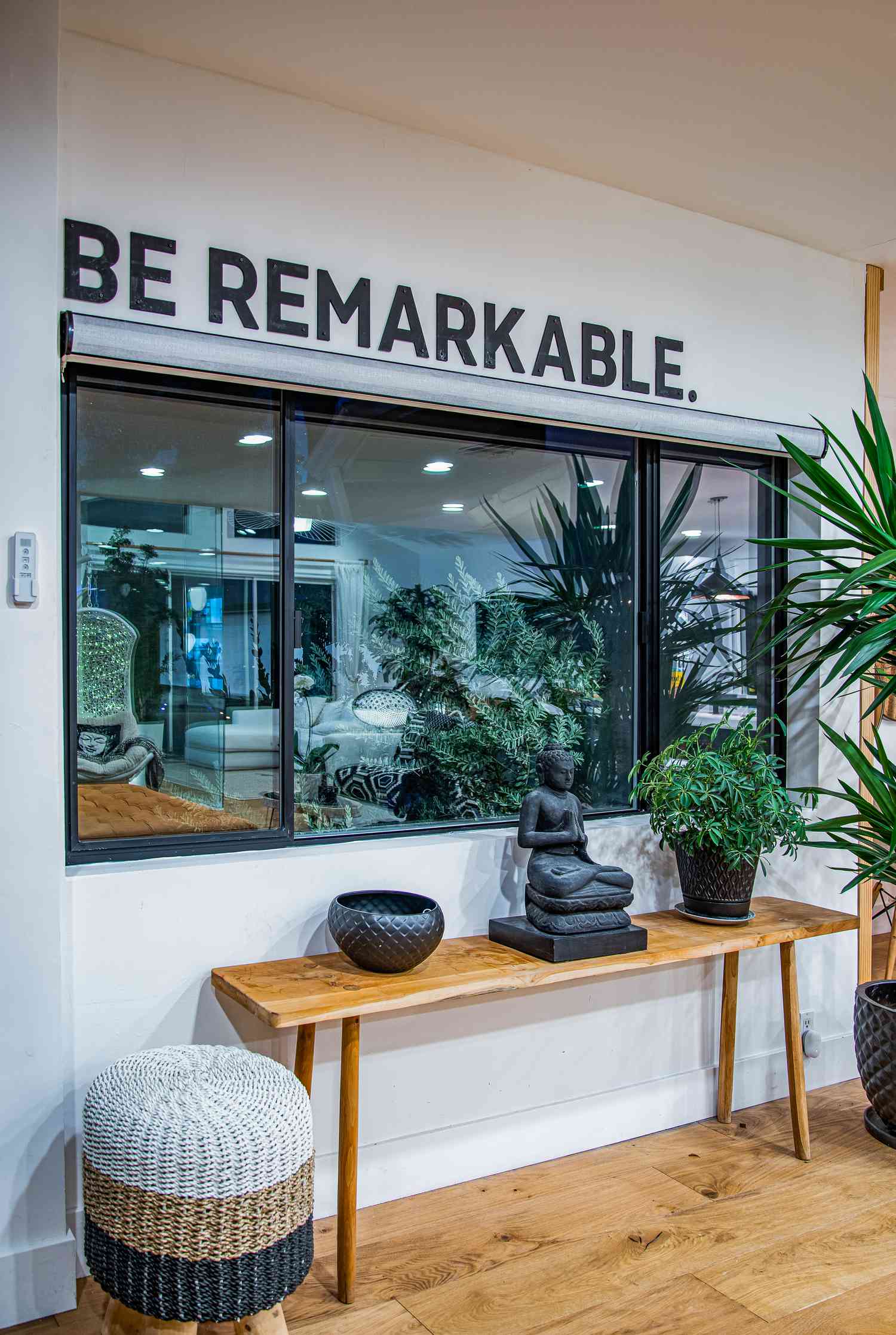 Be remarkable decal on a wall above a window