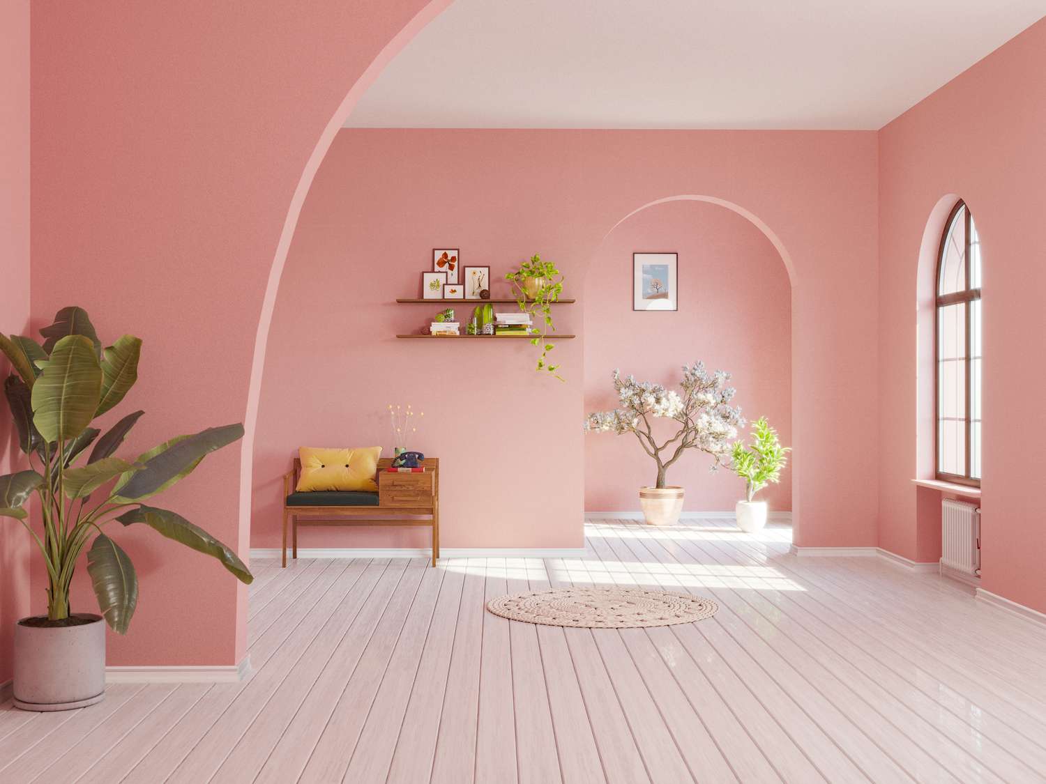 Ein blassrosa Zimmer mit Pflanzen