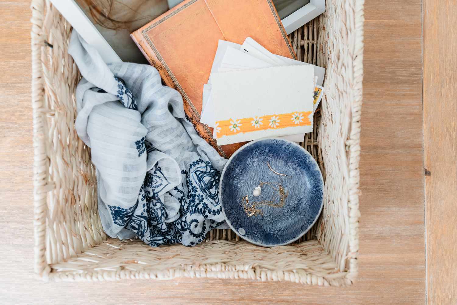 Sentimental items separated in wicker basket for keeping