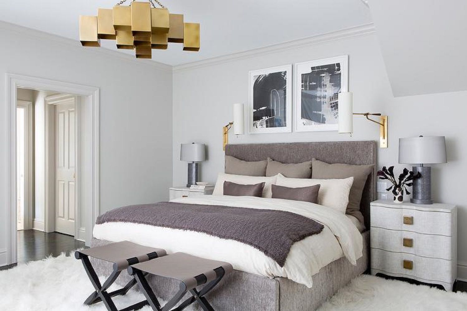 Brass chandelier in bedroom