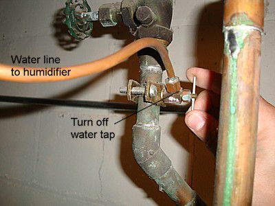 Turning off the water tap on a humidifier