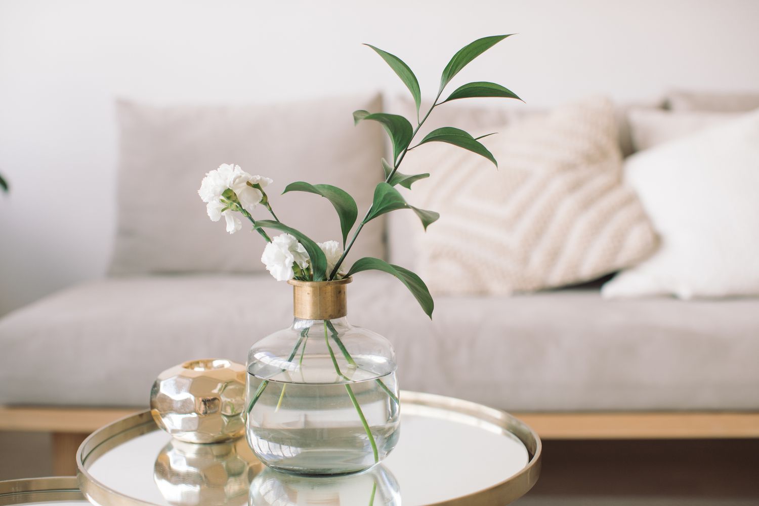 fresh flowers in a vase on a table in living room