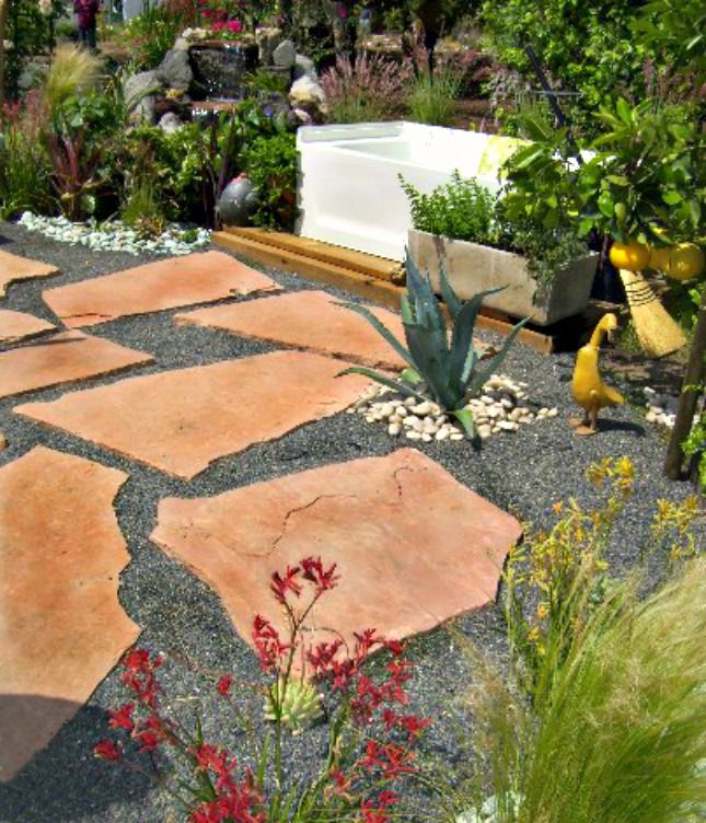 flagstone and gravel patio in a backyard